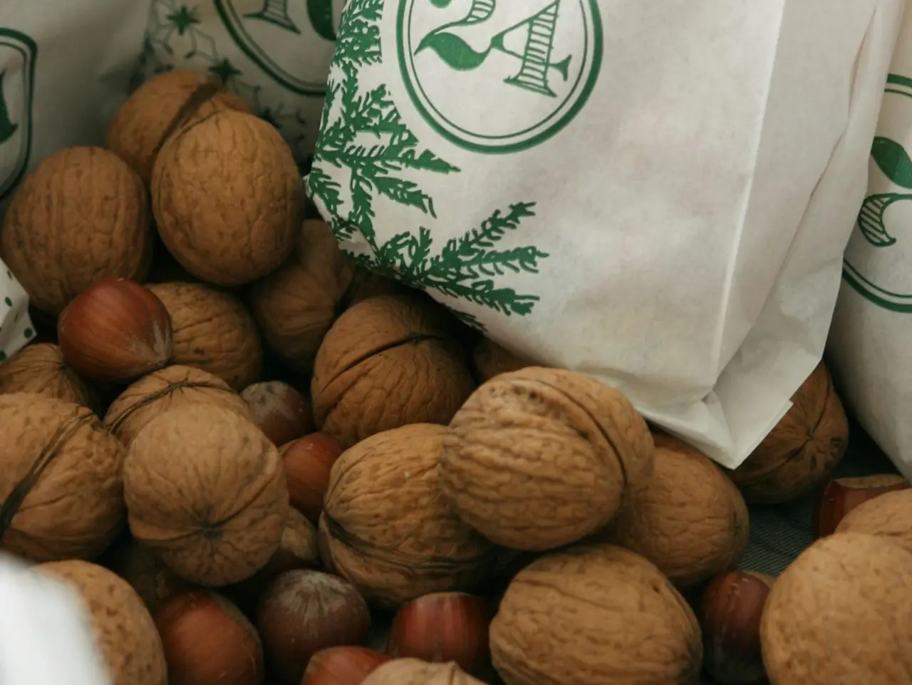 brown round fruits on white plastic bag